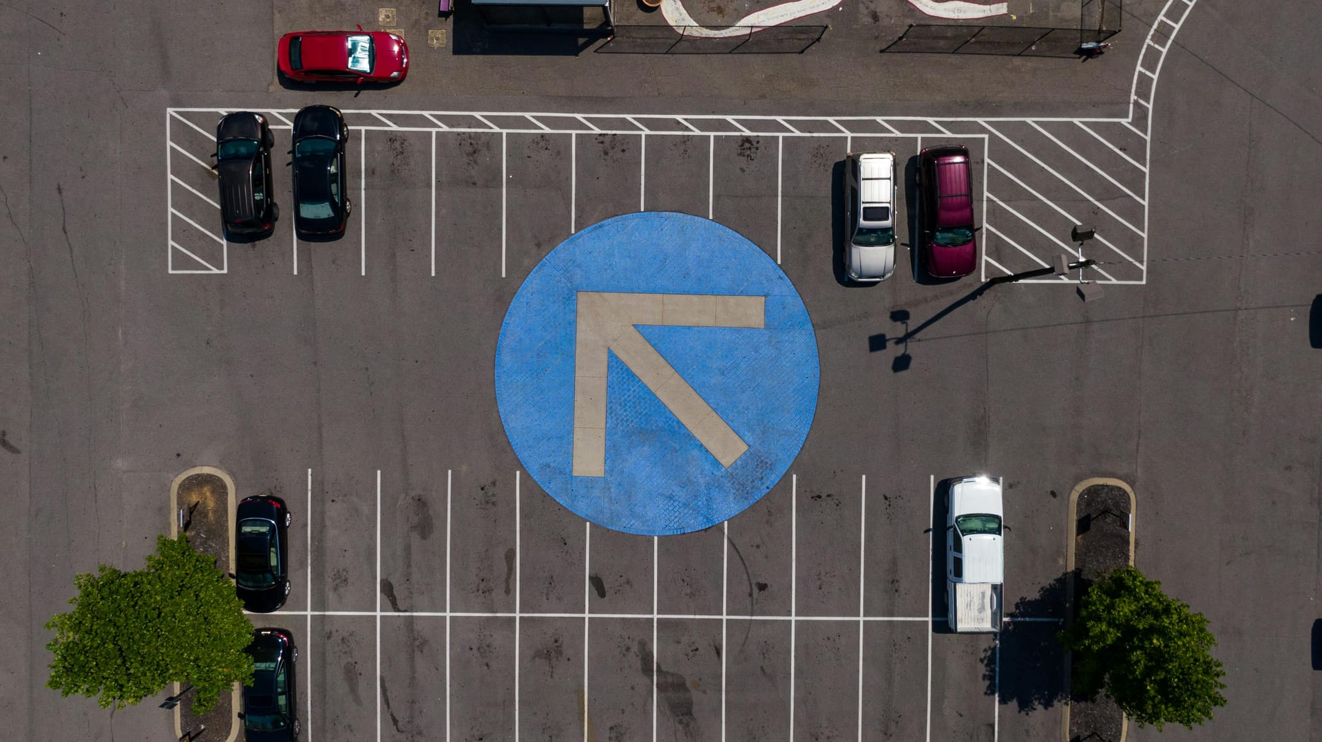 Parking lot with vehicles using AI enforcement
