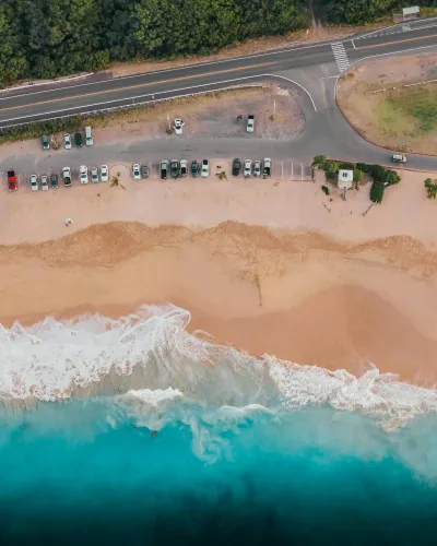 Seasonal parking lot in a ski town or beach destination during peak tourist season.