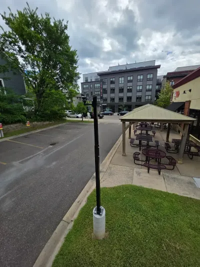 Parking lot with security cameras and LED lighting for safety.
