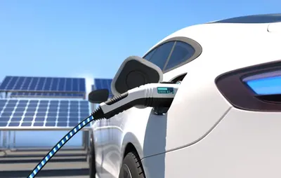 Construction crew installing commercial EV charging infrastructure.