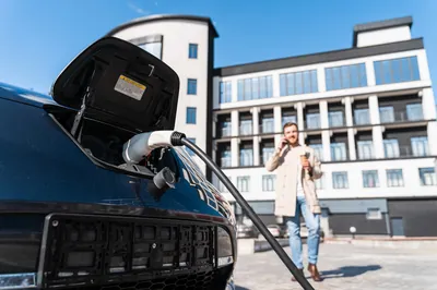 EV charging station at a hotel parking lot.