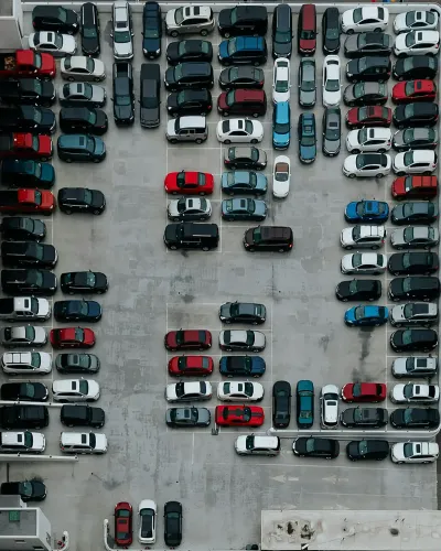 Busy commercial district with high parking demand indicating economic vitality.